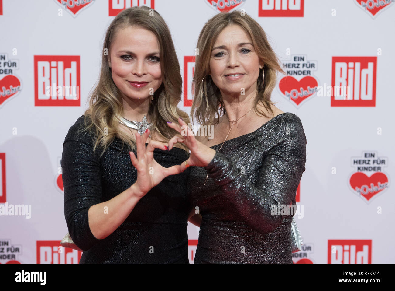 Regina HALMICH (ex-boxing pro) and Tina RULAND (actress), half figure