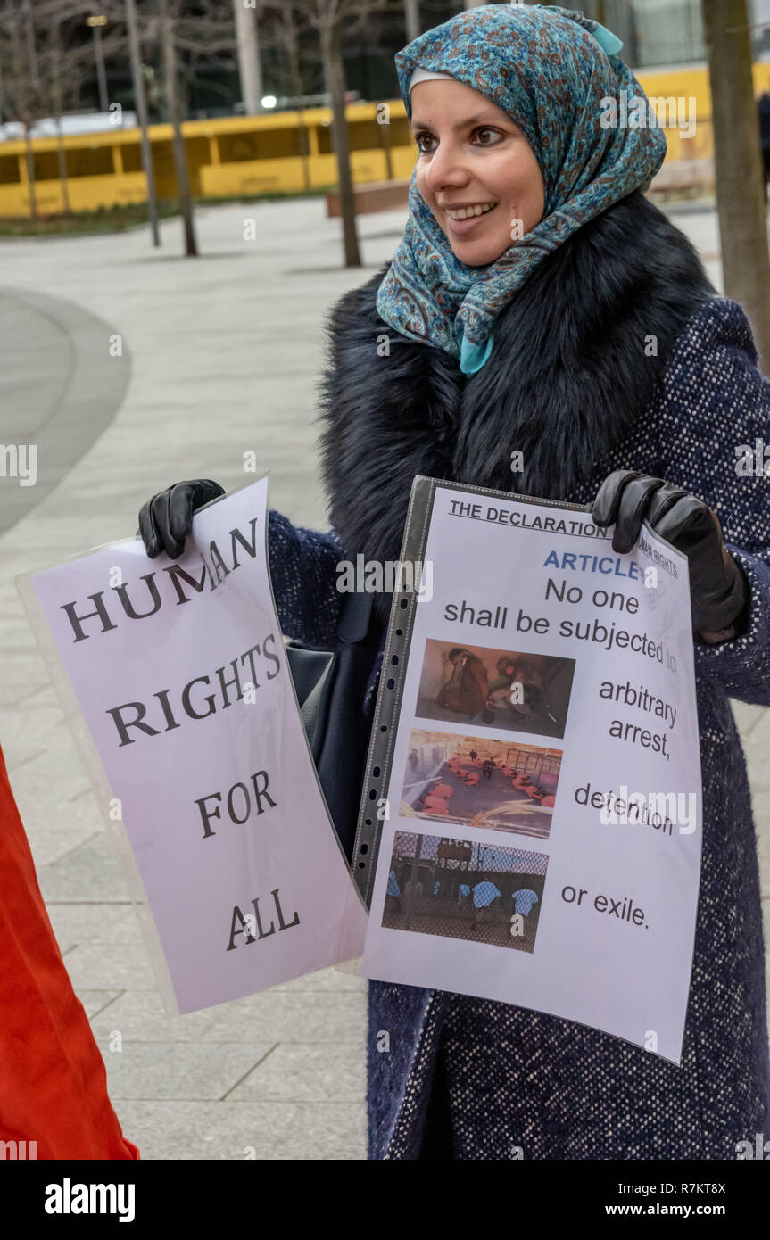 London, UK. 10th December 2018.  A protester at the US Embassy in the final 'Shut Guantanamo!' monthly protest of 2018 on the 70th anniversary of the Universal Declaration of Human Rights (UDHR). This declared "No one shall be subjected to torture or to cruel, inhuman or degrading treatment or punishment" and "No one shall be subjected to arbitrary arrest, detention or exile." Guantanamo still has 40 detainees who have been tortured and held in indefinite detention without trial for almost 17 years. Credit: Peter Marshall/Alamy Live News Stock Photo