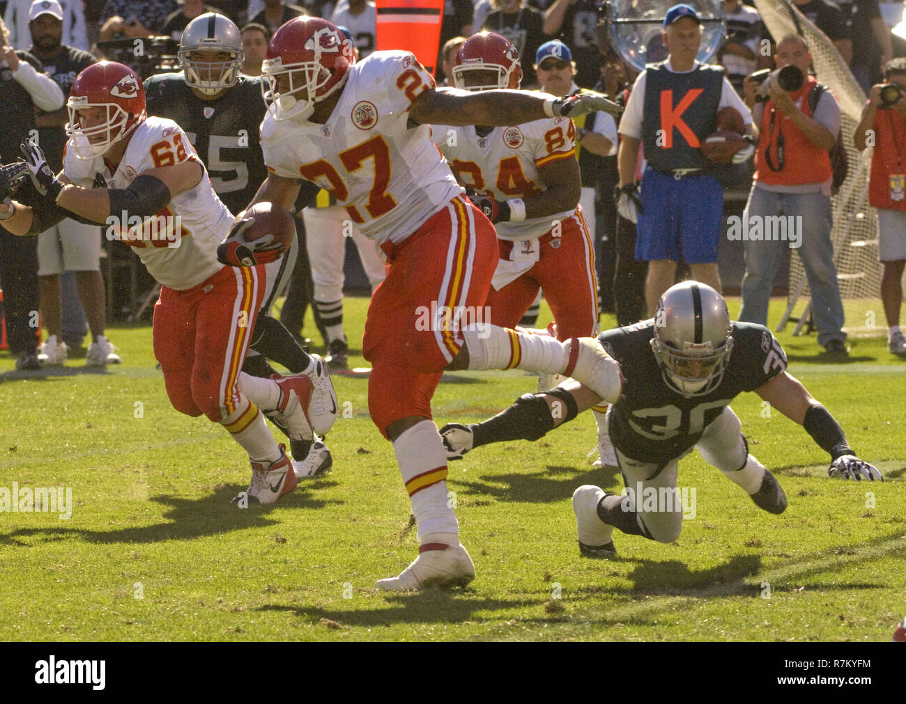 Oakland, California, USA. 30th Nov, 2008. Oakland Raiders linebacker Kirk  Morrison #52 hold on to Kansas City Chiefs running back Larry Johnson #27  while he makes TD on Sunday, November 30, 2008