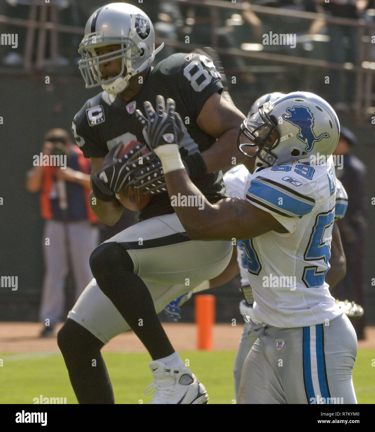 Detroit Lions linebacker Alex Lewis (59), center, celebrates