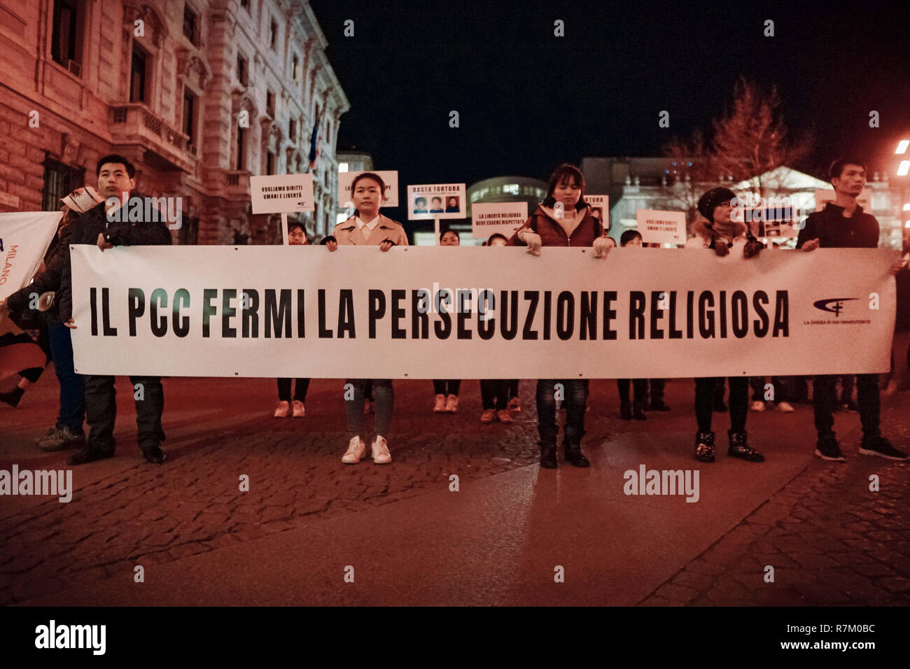 Milan, MI, Italy. 10th Dec, 2018. Participants are seen holding a banner and placards during the event.Amnesty International Italia, Caritas, Emergency Oxfam and Action Aid organized in Milan, and almost other 80 Italian cities a torchlight in order to celebrate the 70 years of the Universal Declaration of Human Rights. With the rising xenophobic acts in the country, the organizing associations would like to underline the importance of the contents and values of the Declaration. Credit: Valeria Ferraro/SOPA Images/ZUMA Wire/Alamy Live News Stock Photo