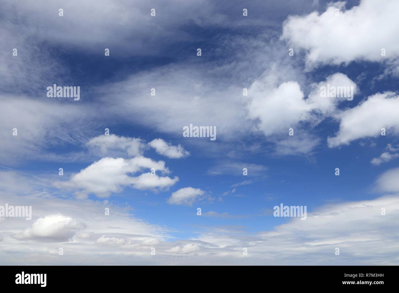Blue sky and white fluffy clouds. Idyllic background abstract Stock ...