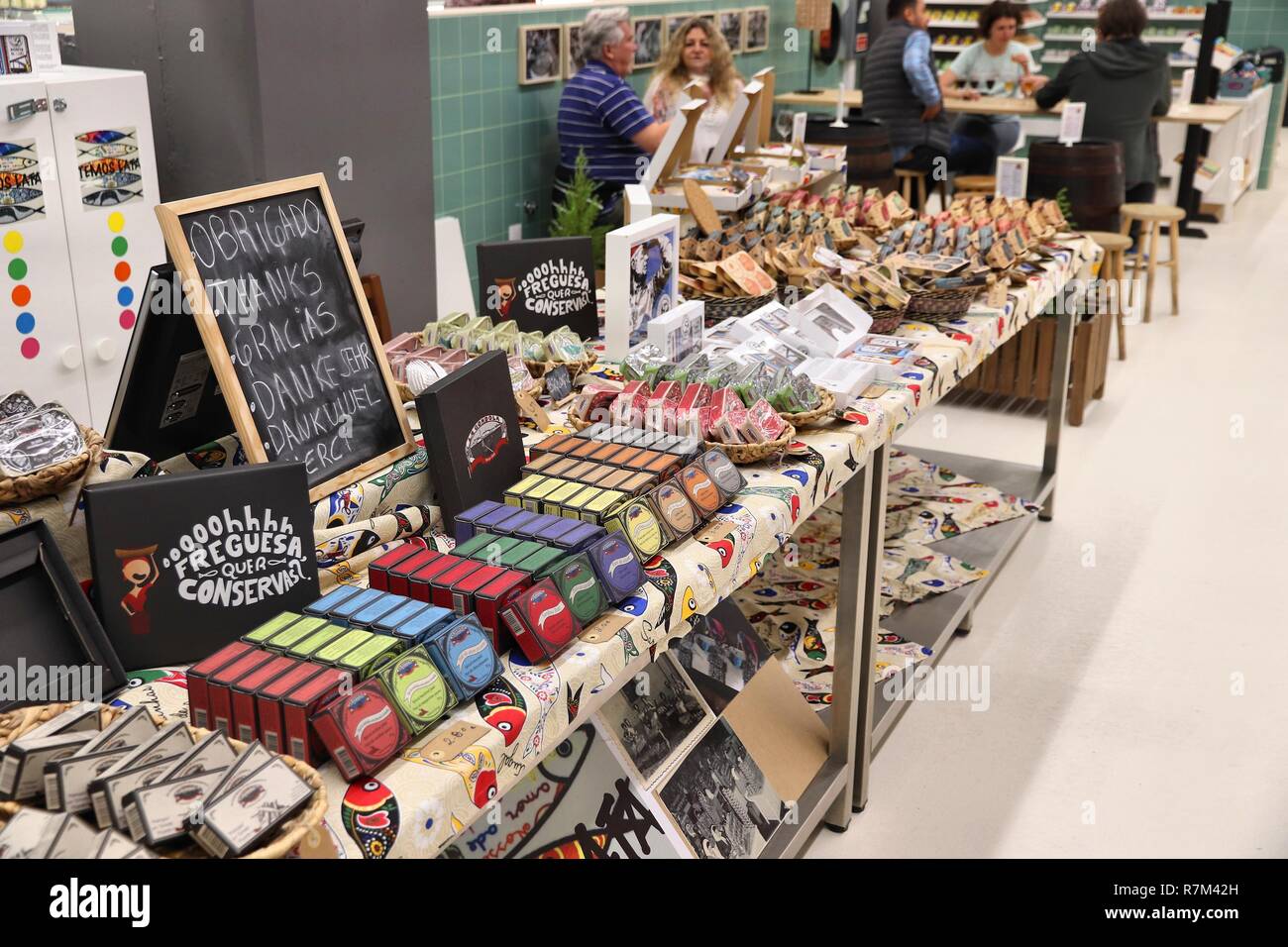 PORTO, PORTUGAL - MAY 24, 2018: Shop with canned sardines and other fish in Mercado do Bolhao, Porto. Tinned fish is  part of traditional Portugese cu Stock Photo