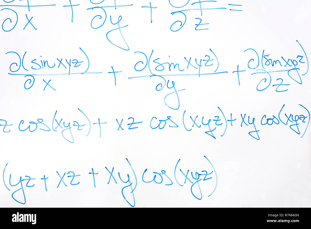 Closeup of complicated mathematical equation written with blue marker ...
