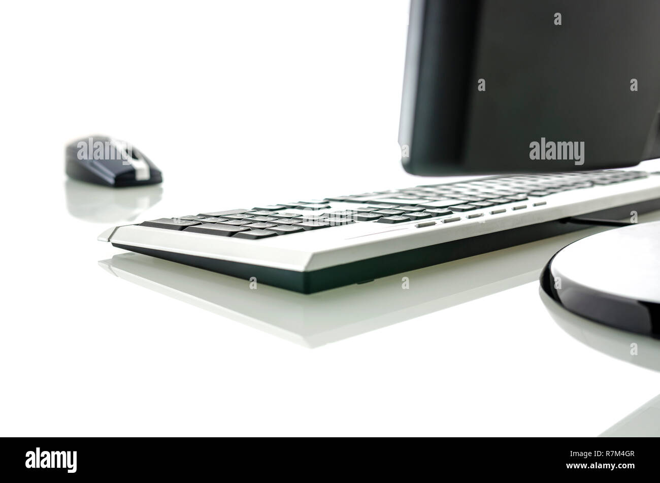Computer equipment on white office desk with reflection Stock Photo - Alamy