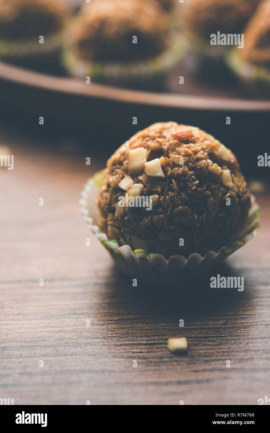 Oats laddu or Ladoo also known as Protein Energy balls. served in a plate or bowl. selective