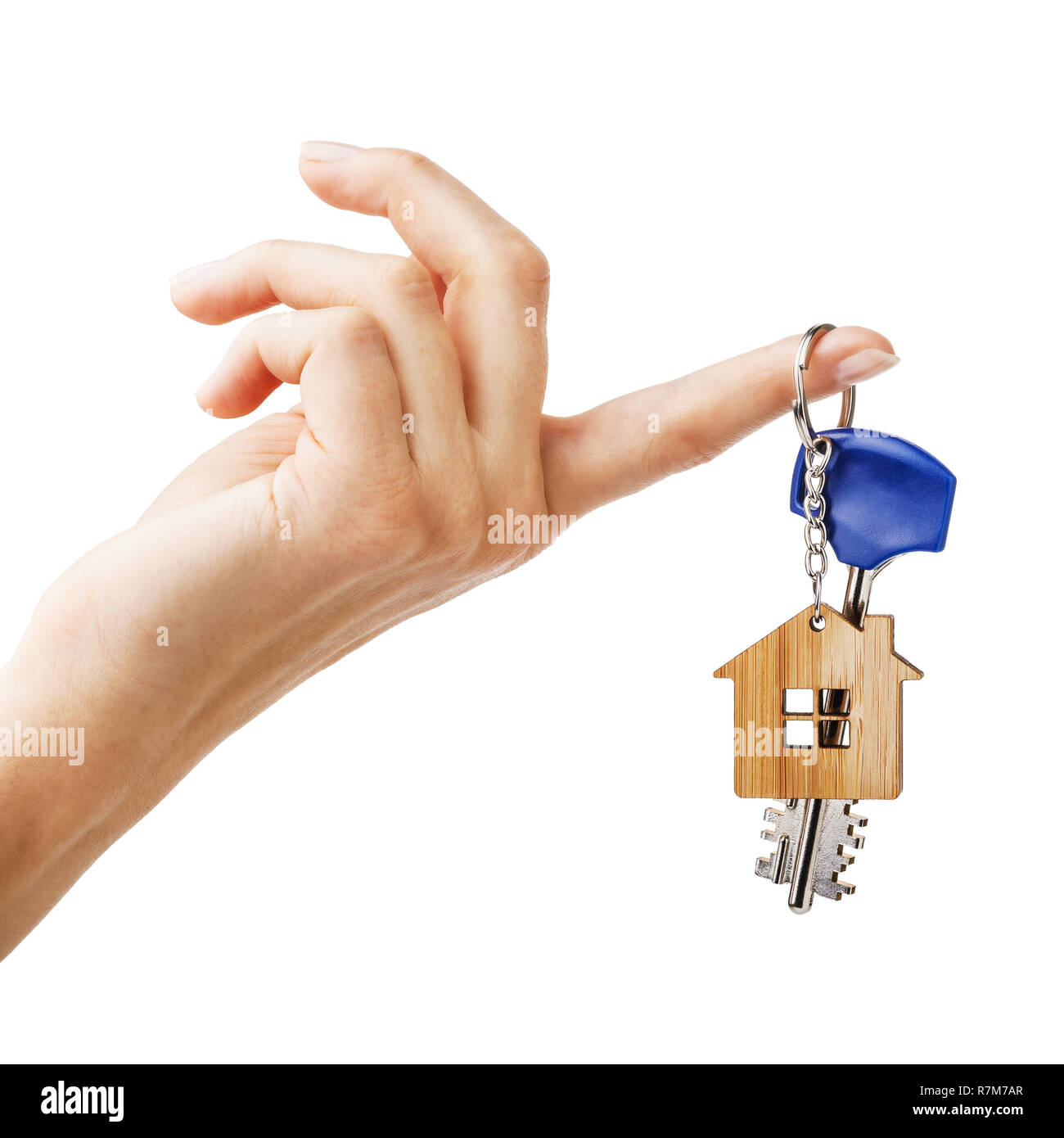House keys on the index finger isolated on white background Stock Photo