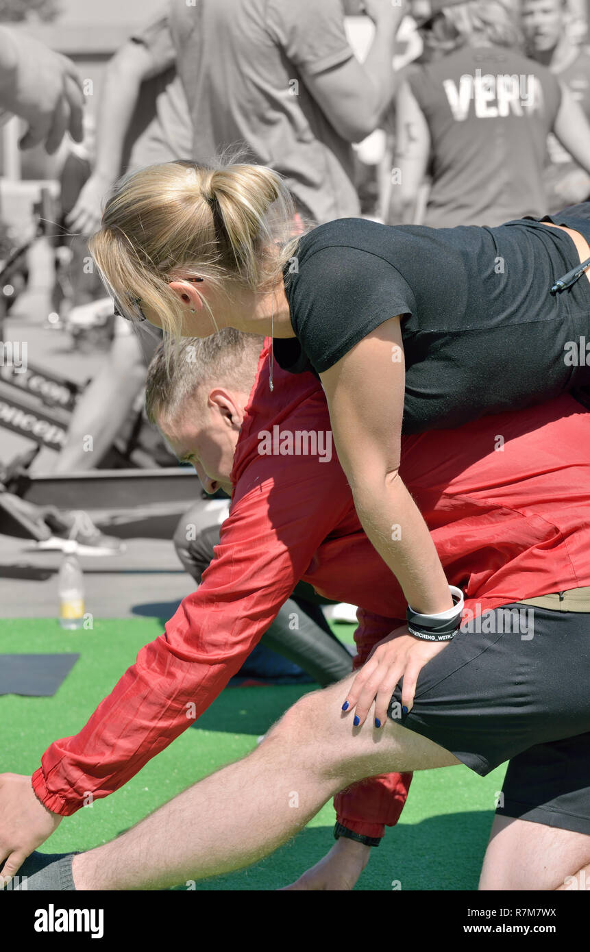 Saint-Petersburg.Russia. may.20.2018.Young girls perform warm-up massage  for athletes.Muscles relax.Fatigue leaves the body.Power and vigor are back  Stock Photo - Alamy