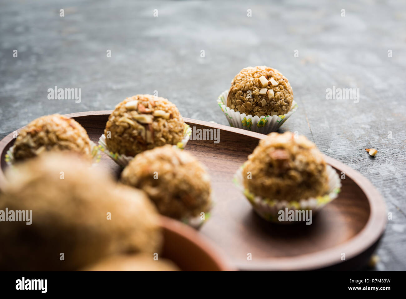 Oats laddu or Ladoo also known as Protein Energy balls. served in a plate or bowl. selective