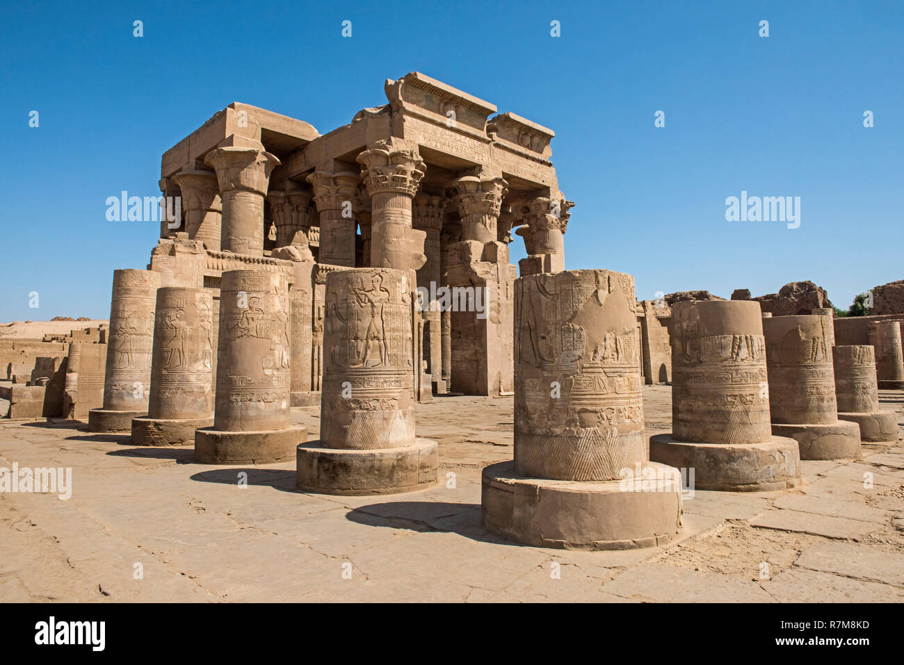 Pillars columns and wall at the entrance to ancient egyptian temple of