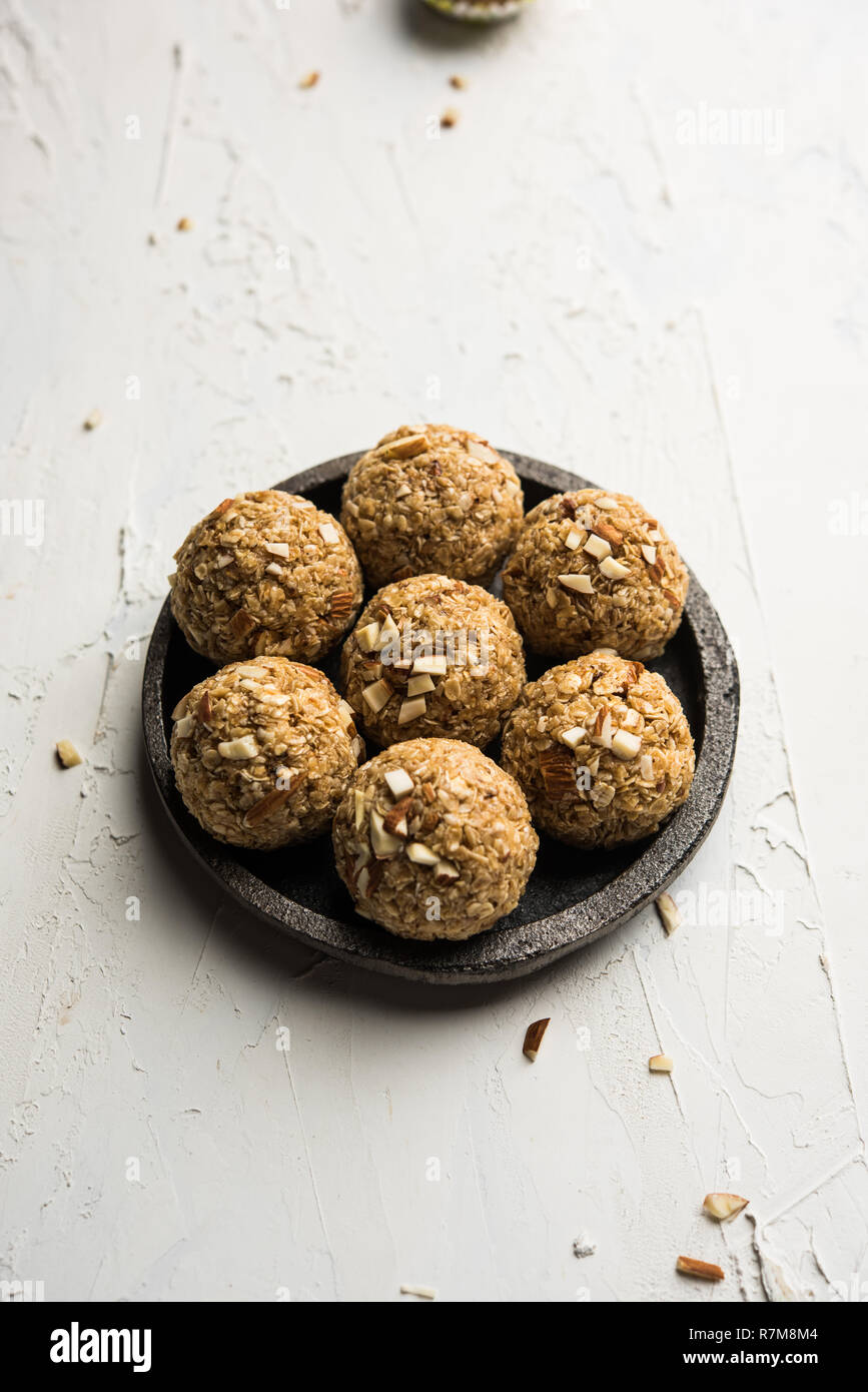 Oats laddu or Ladoo also known as Protein Energy balls. served in a plate or bowl. selective
