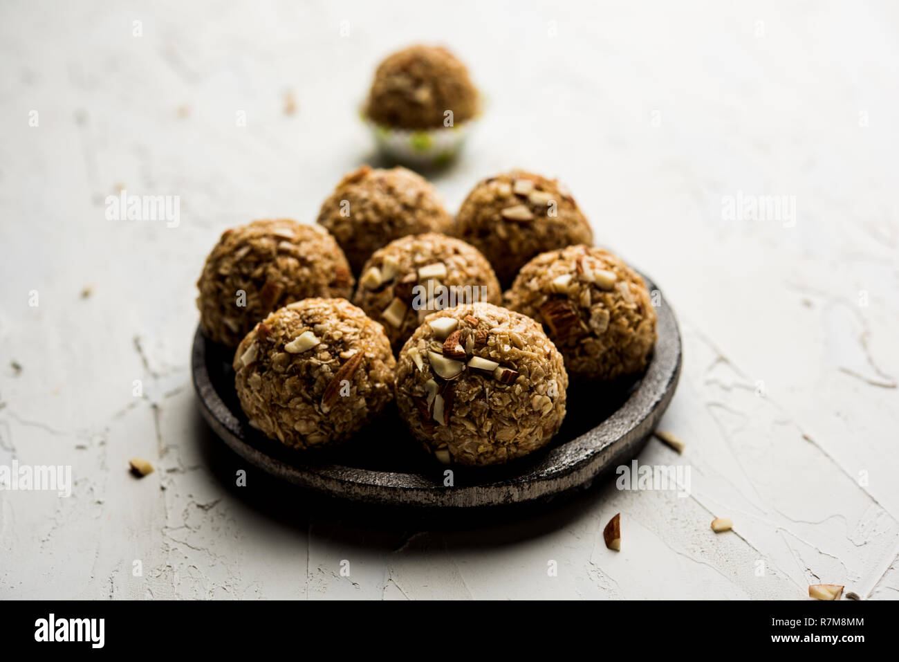 Oats laddu or Ladoo also known as Protein Energy balls. served in a plate or bowl. selective