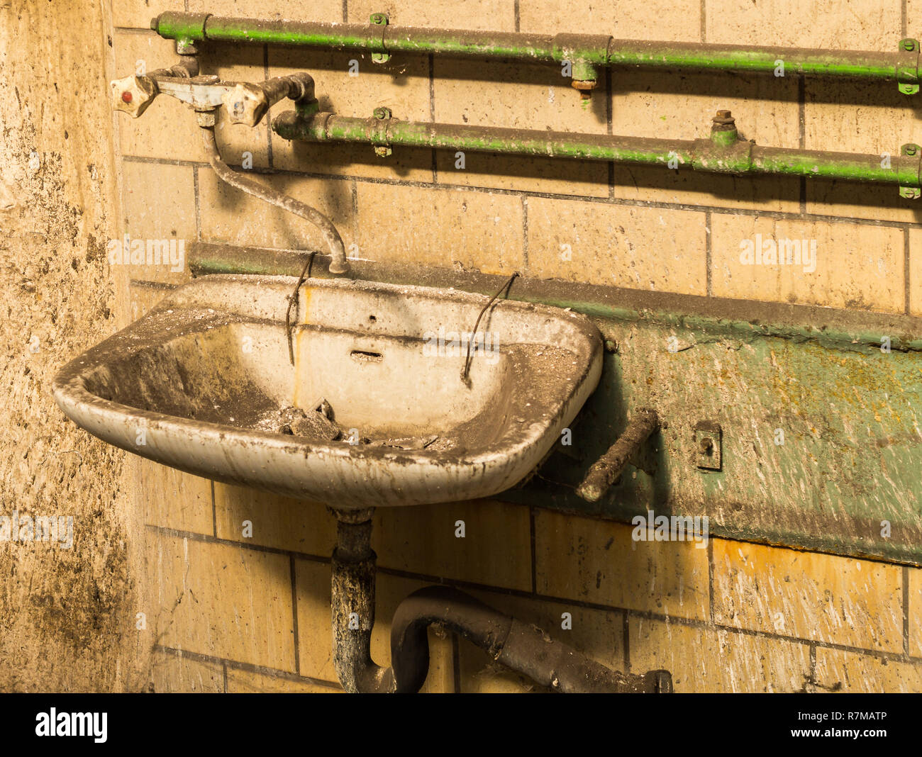 Old dirty washbasin Stock Photo