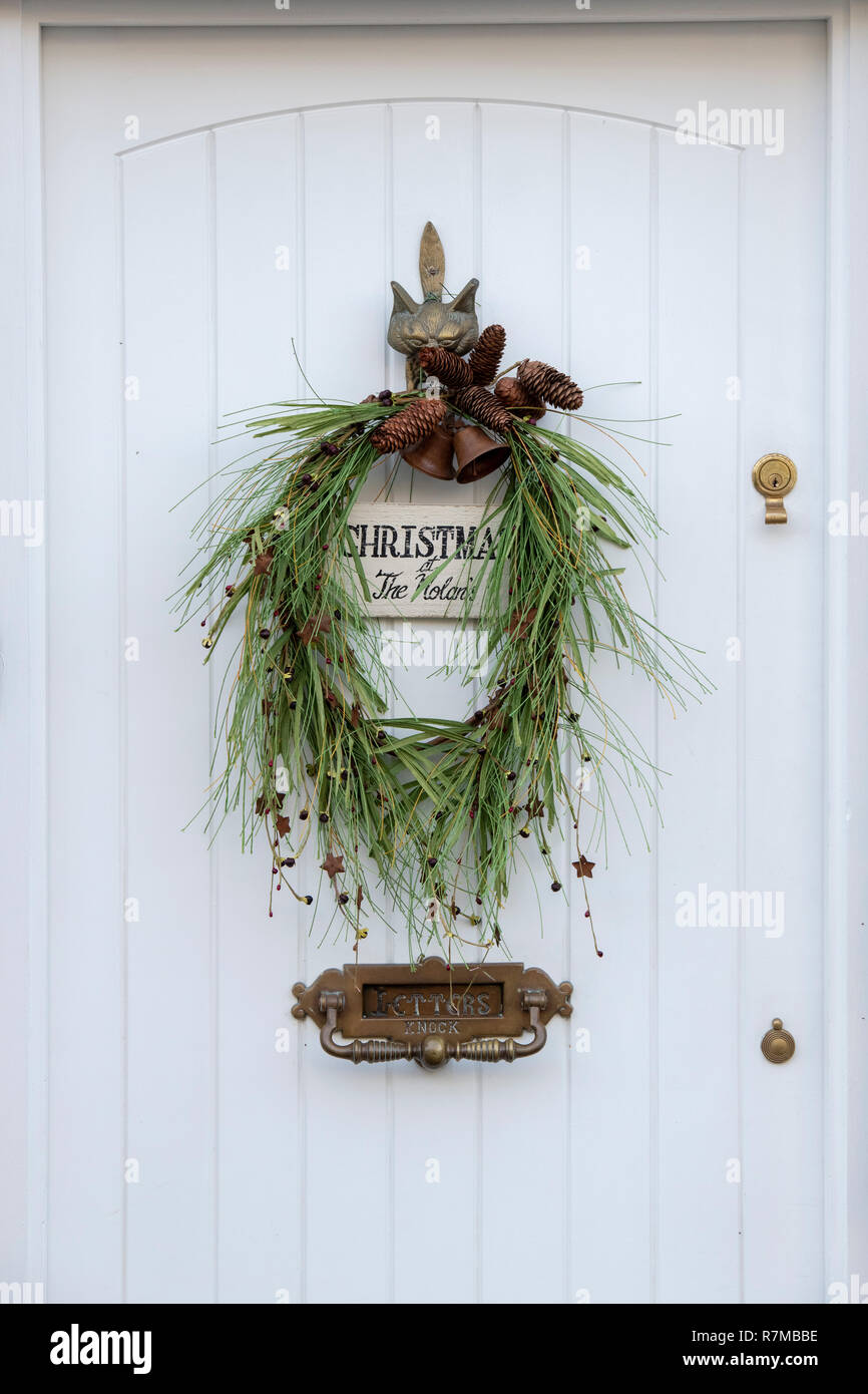 Christmas wreath on a cottage door in Burford. Cotswolds, Oxfordshire