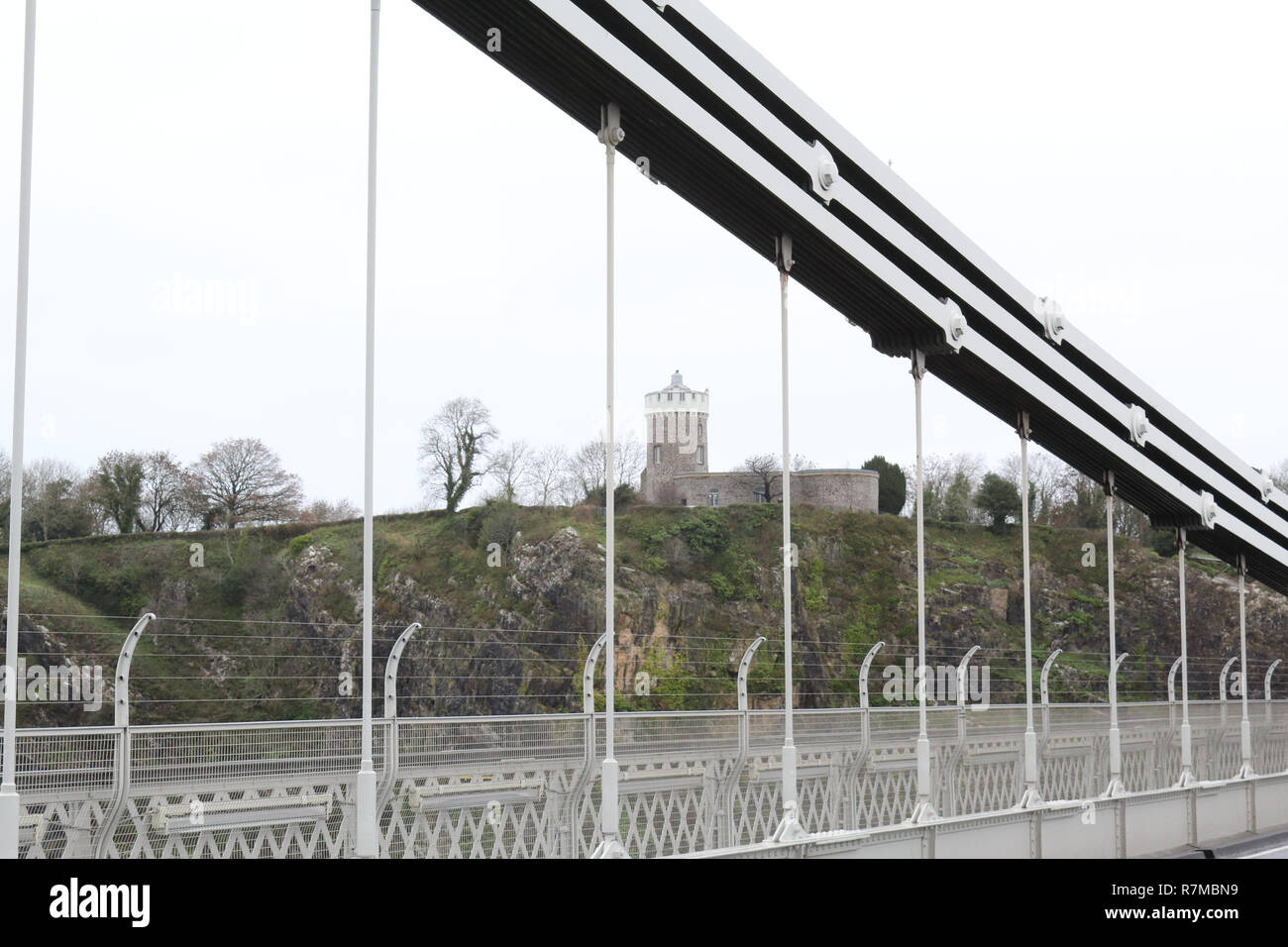A detail of the deck, the suspender and main cables and the tower of the Clifton Suspension Bridge over the Avon river in Bristol, United Kingdom Stock Photo