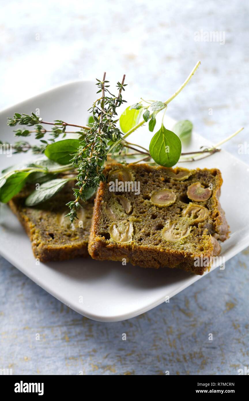 Cake with matcha and black olives with Herbes de Provence Stock Photo