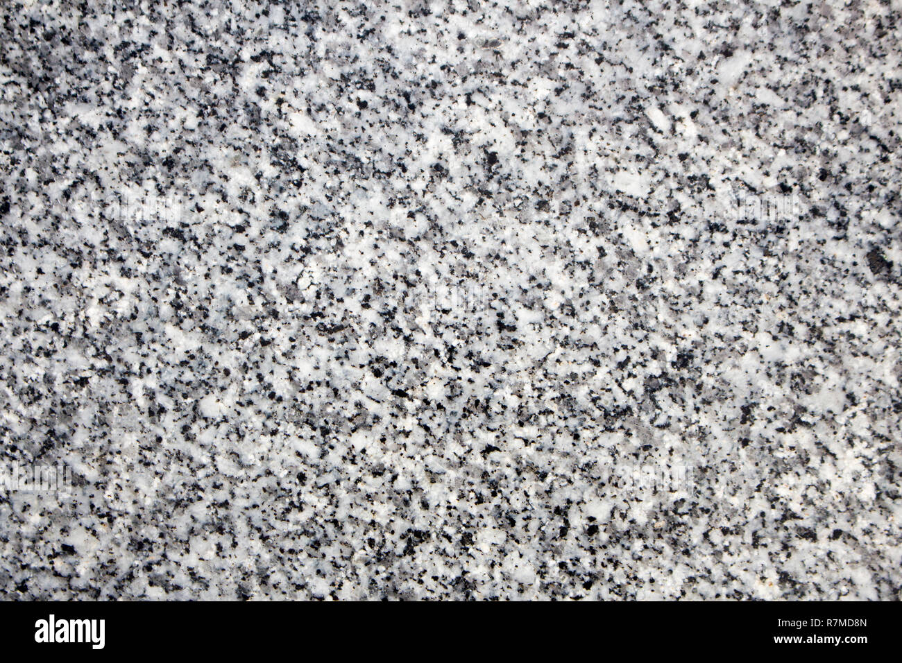 Granite stone background. Black, gray and white colored granite texture