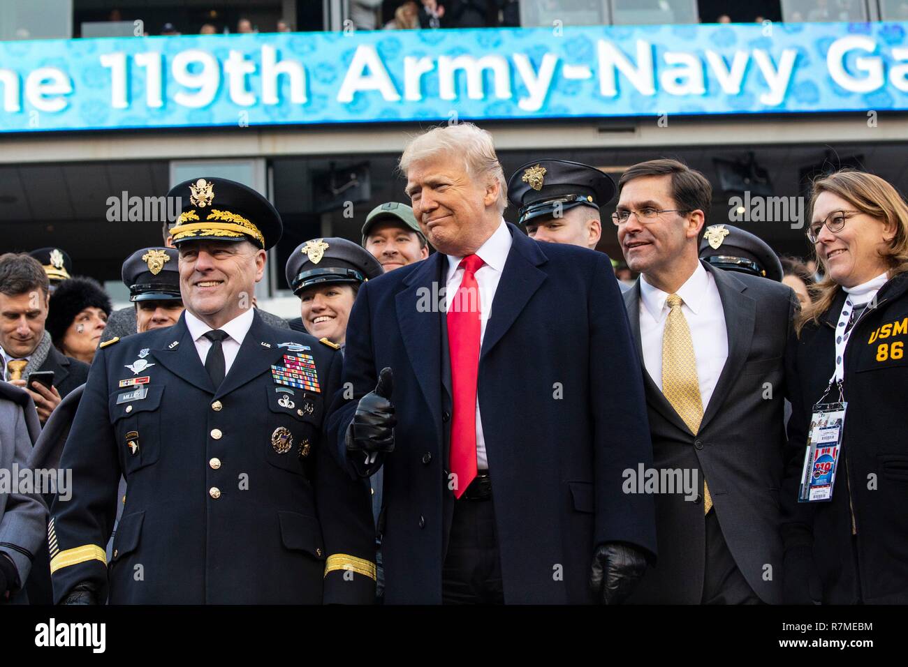 U.S President Donald Trump, center, stands with Army Secretary Dr. Mark Esper, right, and Army Chief of Staff Mark Milley, left, before the start of the 119th Army Navy game at Lincoln Financial Field December 8, 2018  in Philadelphia, Pennsylvania. Stock Photo