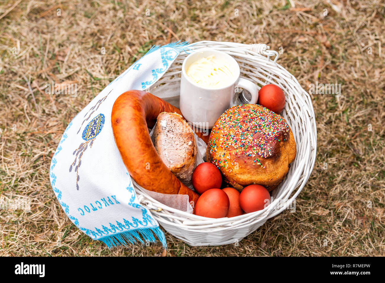 Russian Orthodox Easter blessing wicker straw basket with sausage meat
