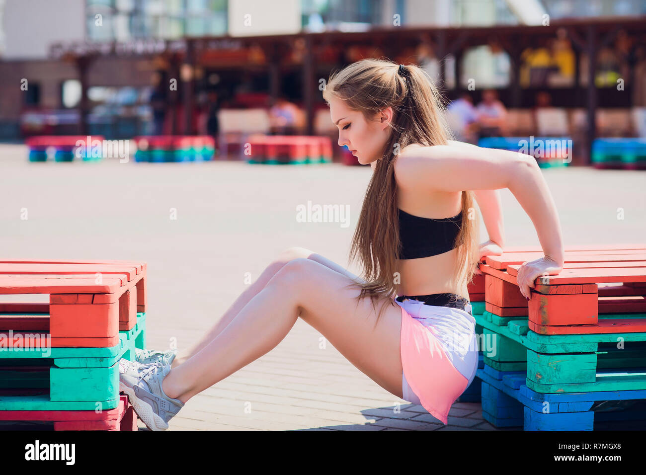 Fitness sporty girl wearing fashion sportswear over street wall, outdoor  sports, urban style. Teen model in swag clothes posing outside Stock Photo  - Alamy