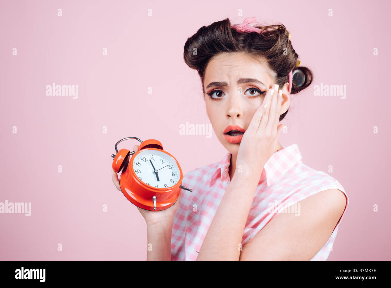 good morning. time management. pinup girl with fashion hair. retro woman  with alarm clock. Time. pin