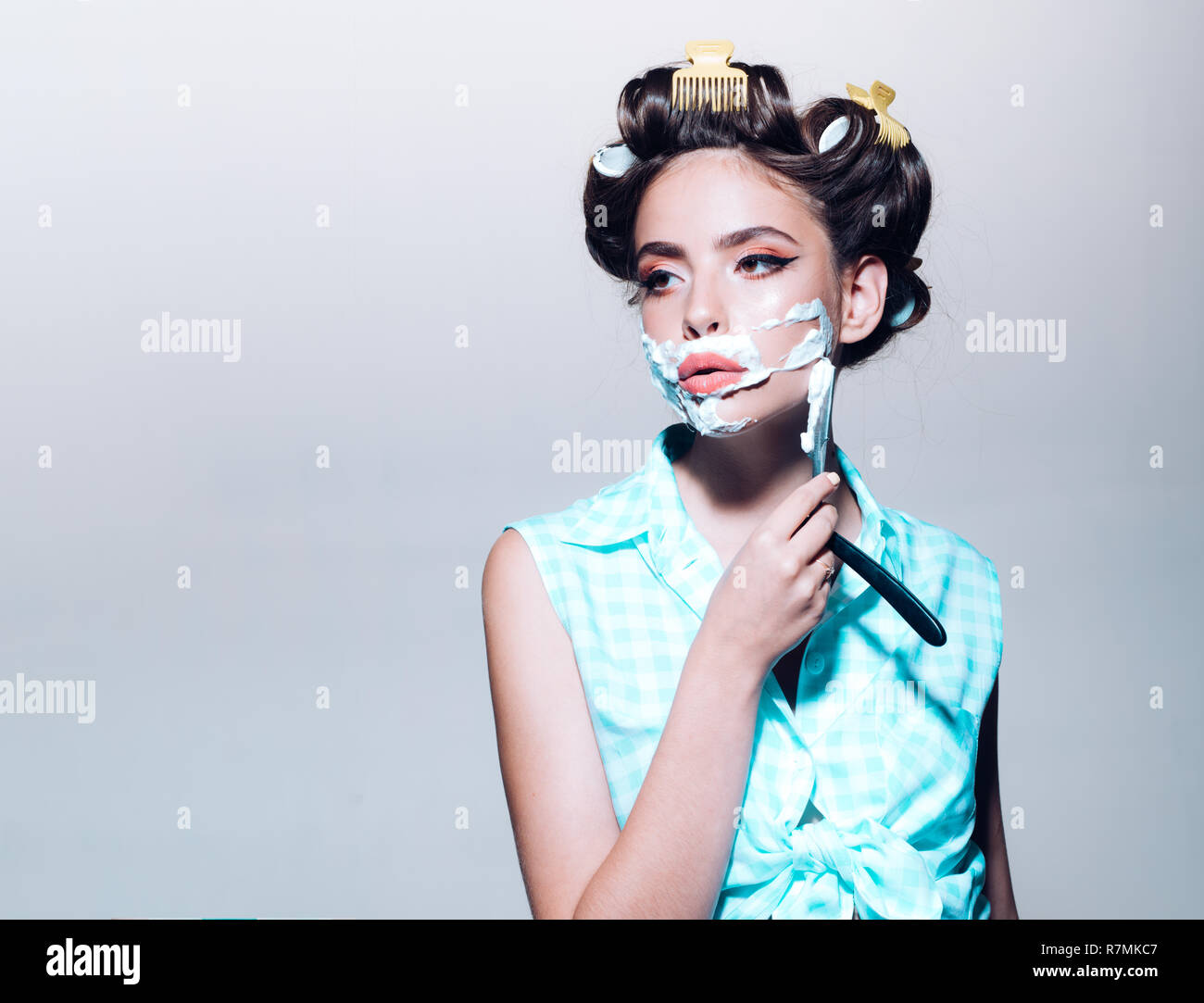 pretty girl in vintage style. retro woman shaving with foam and razor ...