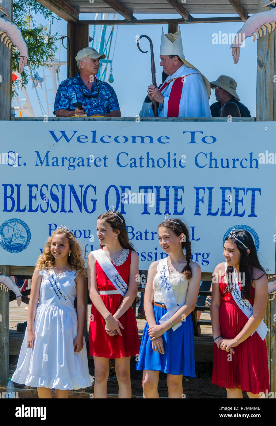 The 65th annual Blessing of the Fleet court waits for Archbishop Thomas J. Rodi (above right) to deliver the prayer in Bayou La Batre, Alabama. Stock Photo