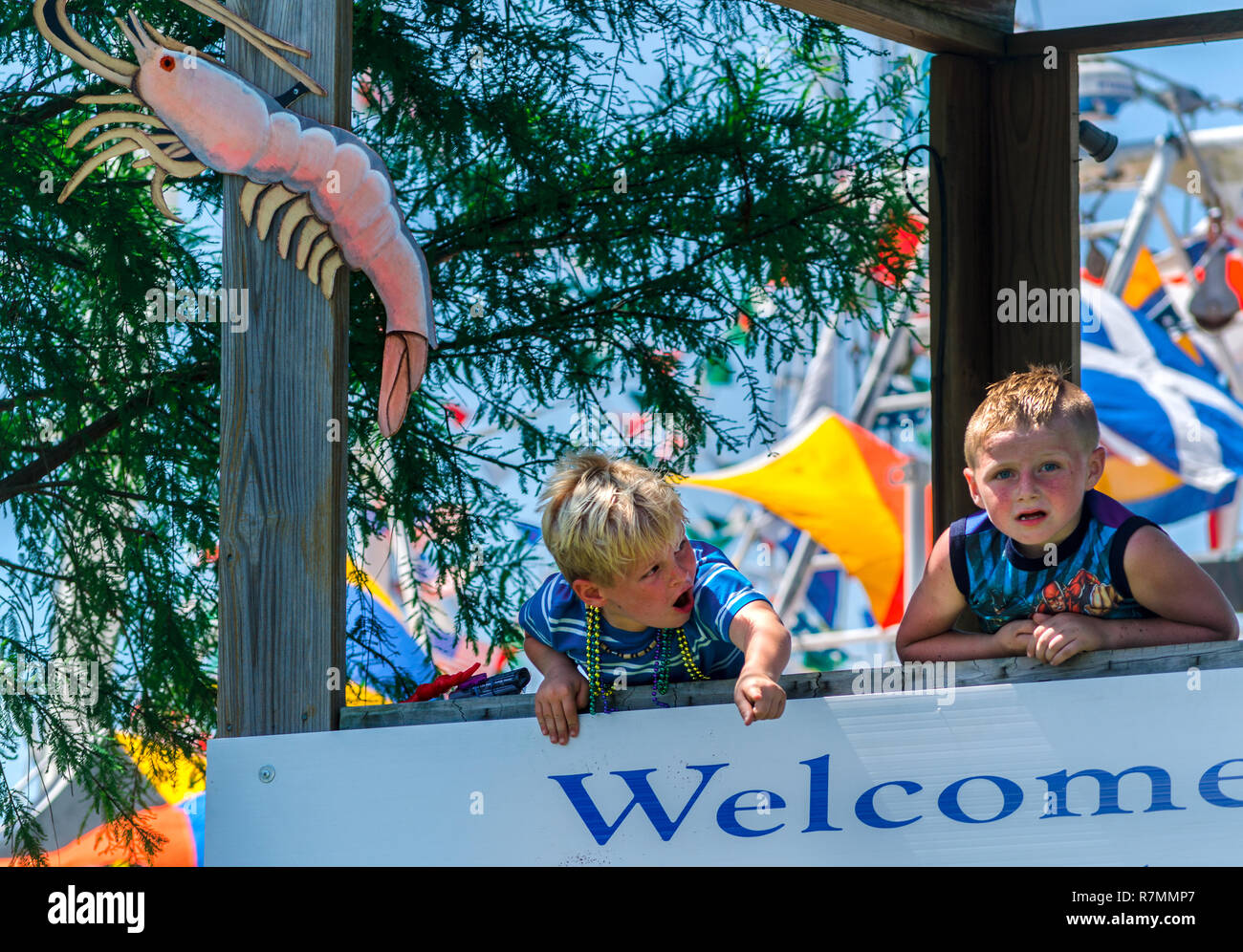 A young boy points at the Alma Bryant High School marching band lduring