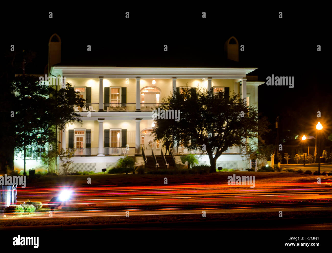 Light streaks form as cars pass the Biloxi Visitors Center, Nov. 24, 2012, in Biloxi, Mississippi. Stock Photo