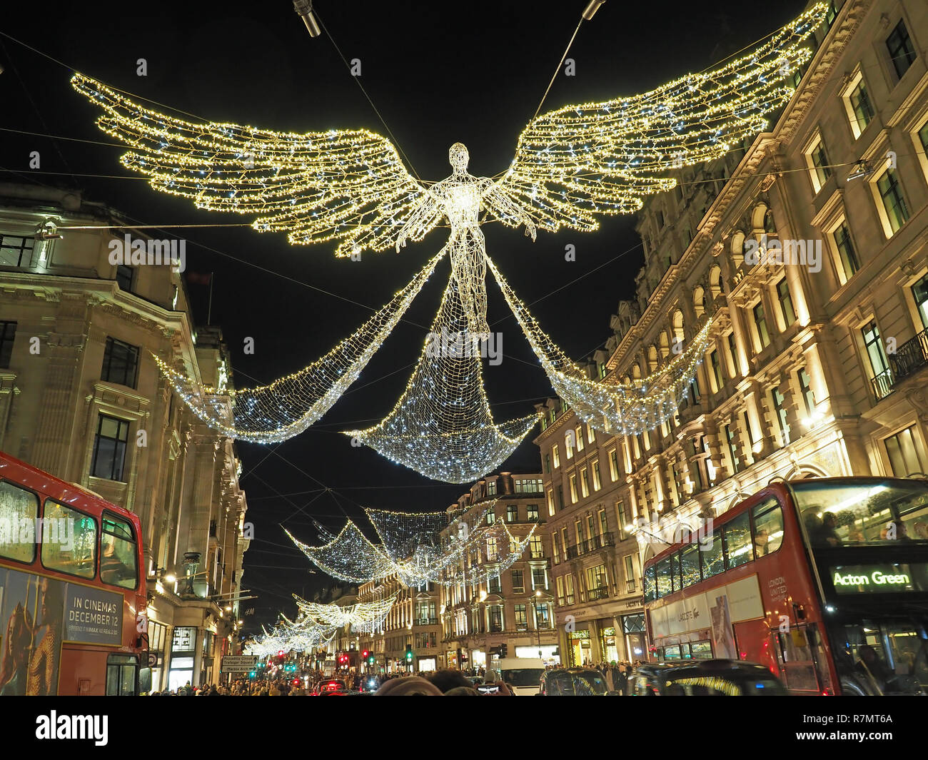 View looking up at the festive Christmas decorations at night in Regent Street London 2018 Stock Photo