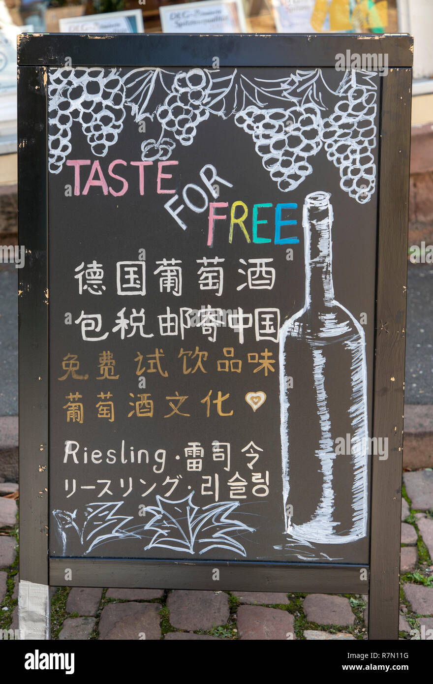 Heidelberg, Baden-WŸrttemberg, blackboard in front of a wine shop, in various Asian languages, wine tasting, Stock Photo