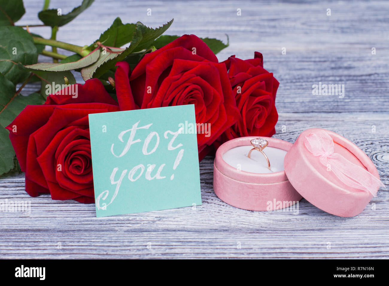 Jewelry ring in box and red roses. Love, proposal, Valentines Day ...