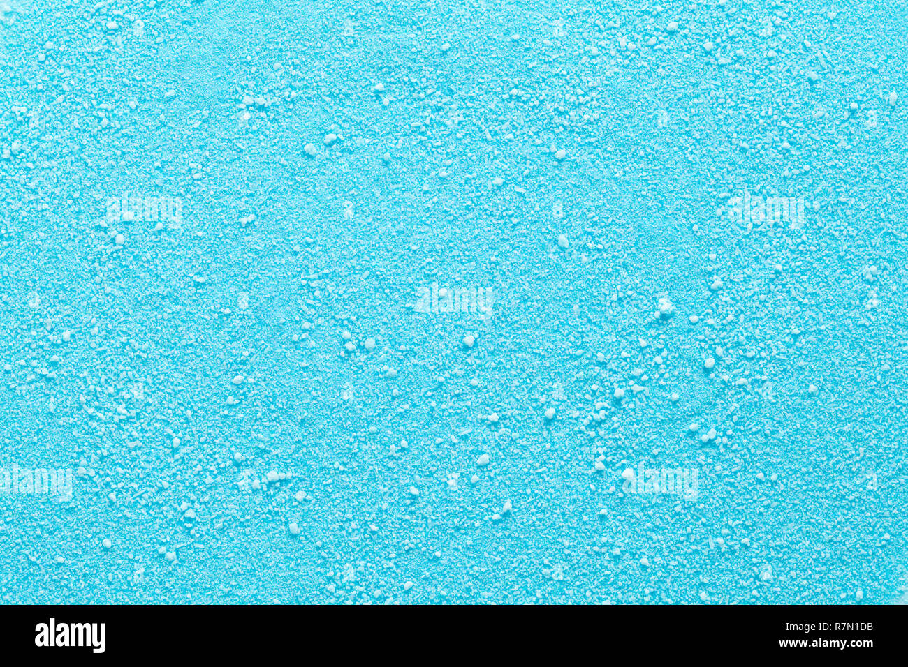 Blue Granulated Candy Sugar Textured Background Close Up. Stock Photo
