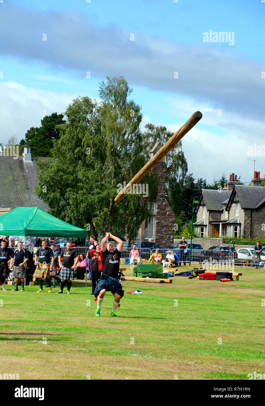 Man Tossing the caber at the highland games event  of 2018 at Aboyne, , Scotland Stock Photo