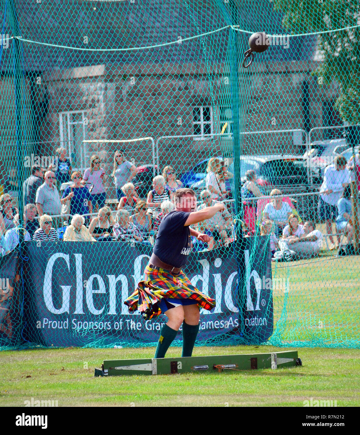 Throwing weight by ring event held at the Aboyne highland games in Aberdeenshire Scotland Stock Photo