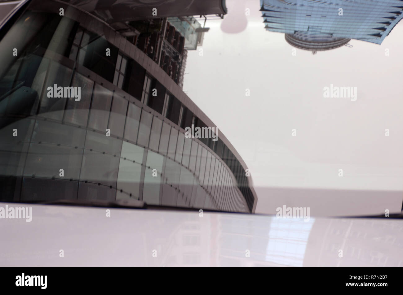 Reflection of high rise office buildings in a car windscreen, Hong Kong, China. Stock Photo