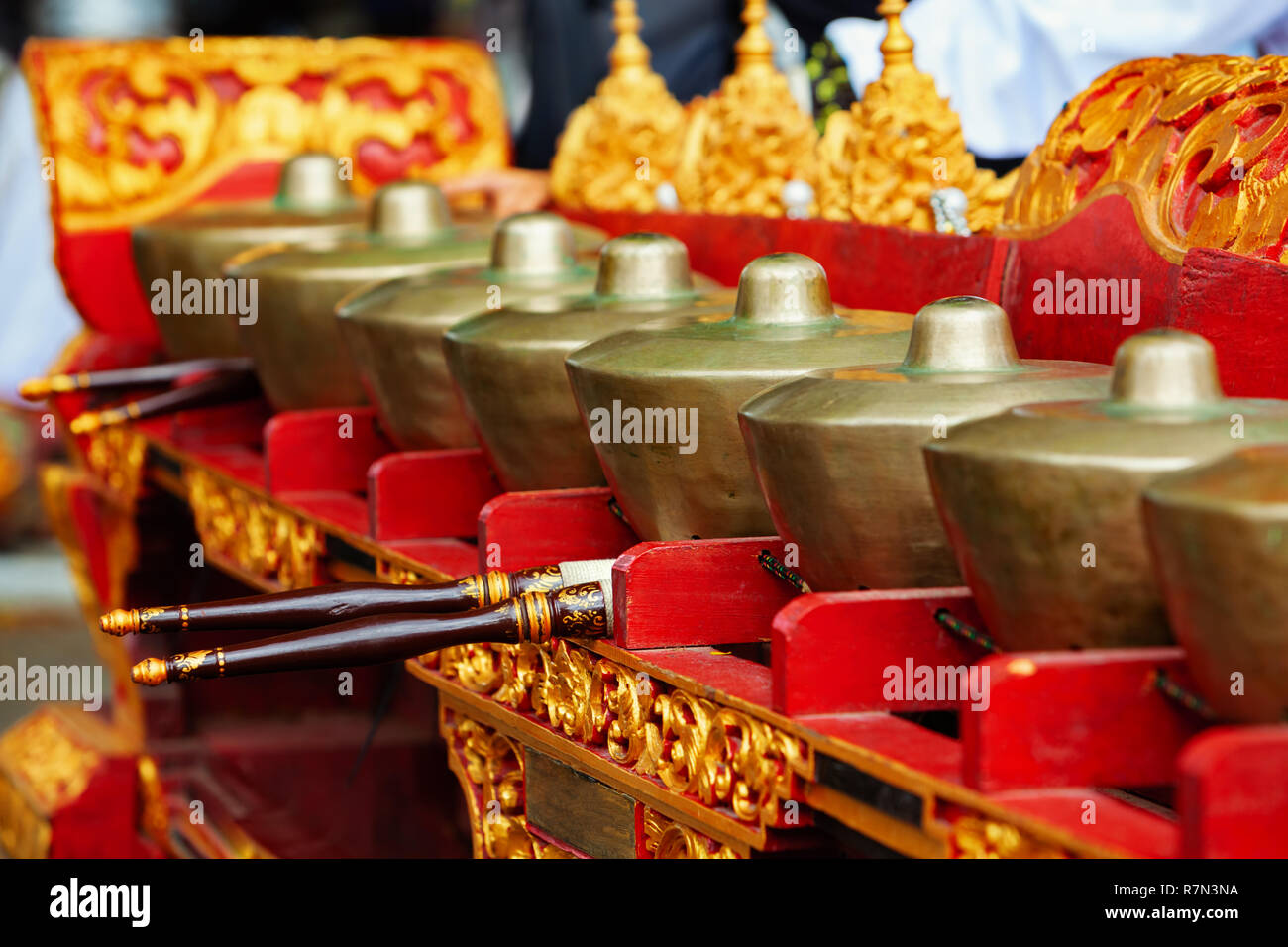Musical instrument Reyong ( Reong) - brass gongs with mallets, part of Traditional Balinese orchestra Gamelan Kebyar. Arts, music, culture of Bali Stock Photo