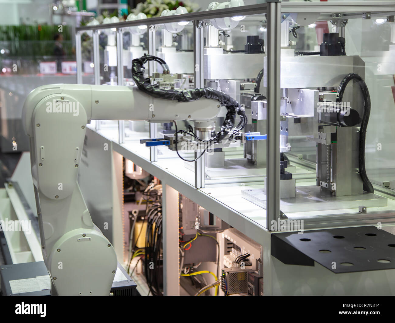 Industry automated robot arm loading and unloading workpieces in ...