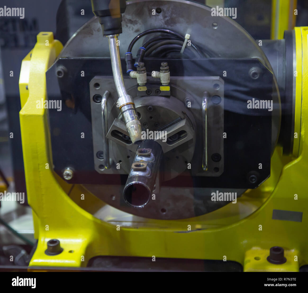 6 axis industry robotic arc machine welding nipple to pipe Stock Photo