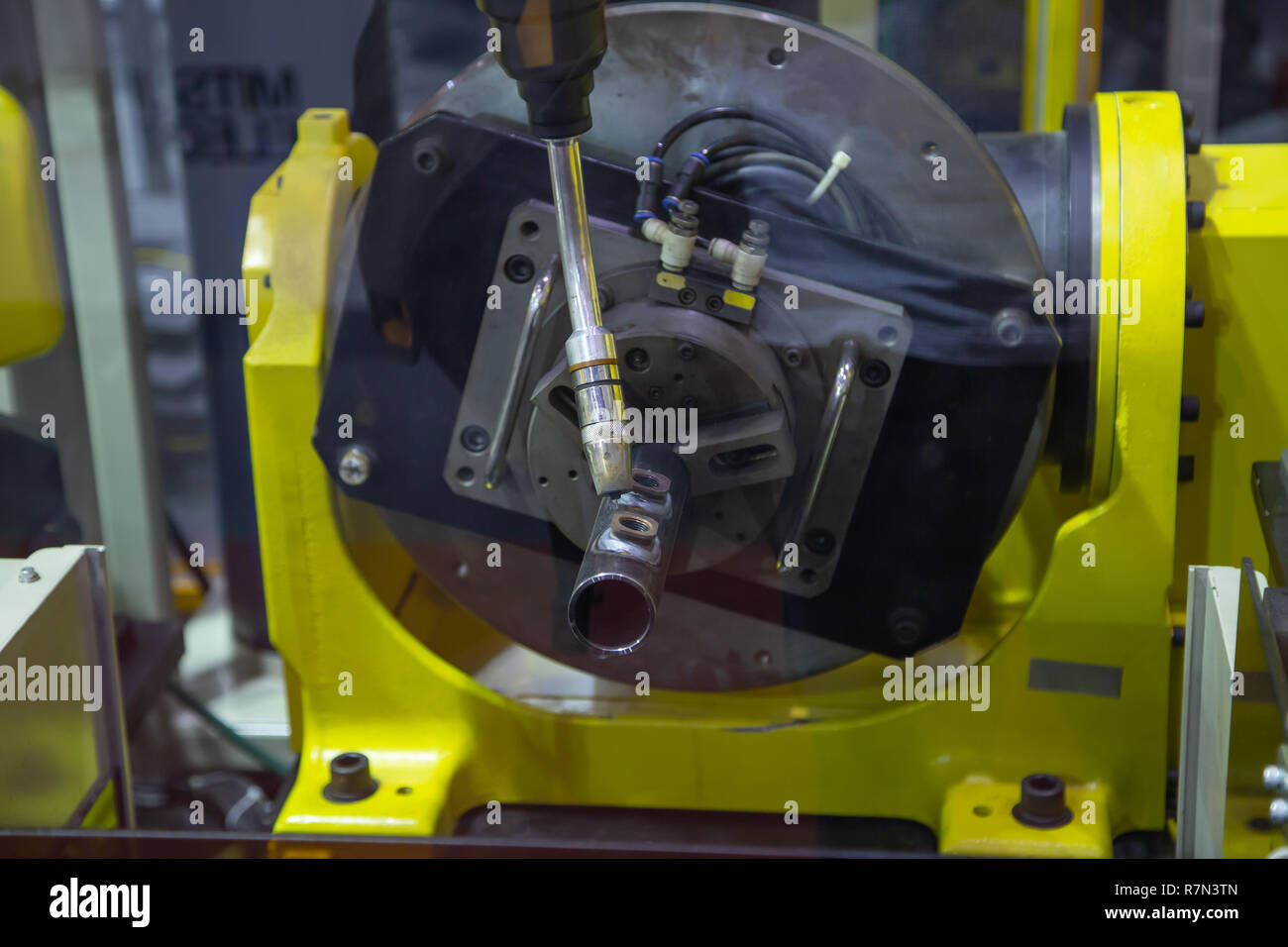 6 axis industry robotic arc machine welding nipple to pipe Stock Photo