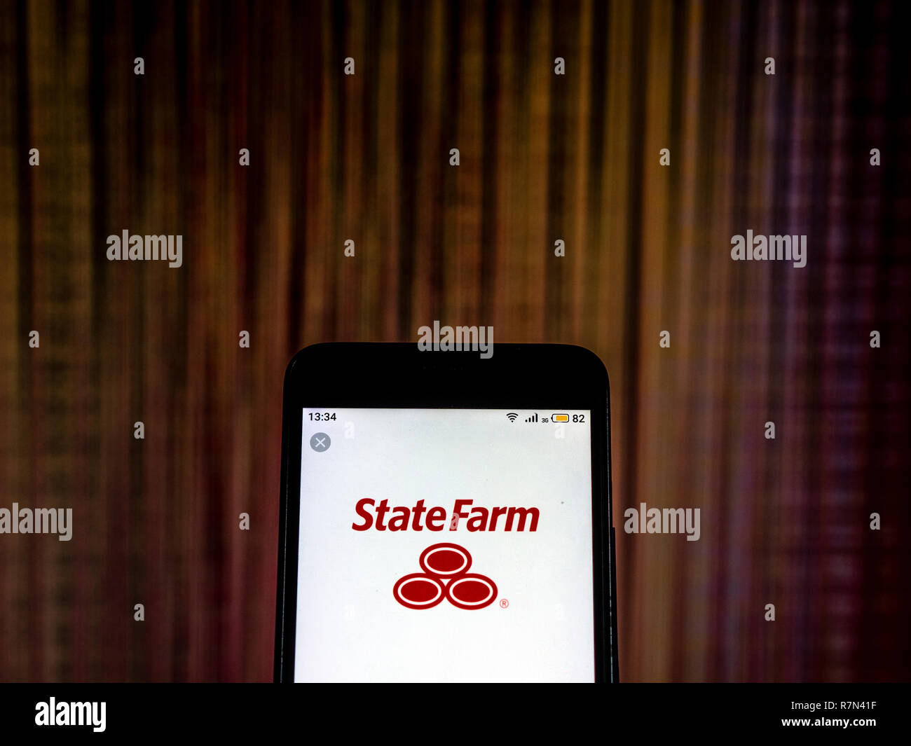 State farm insurance company logo seen displayed on smart phone stock