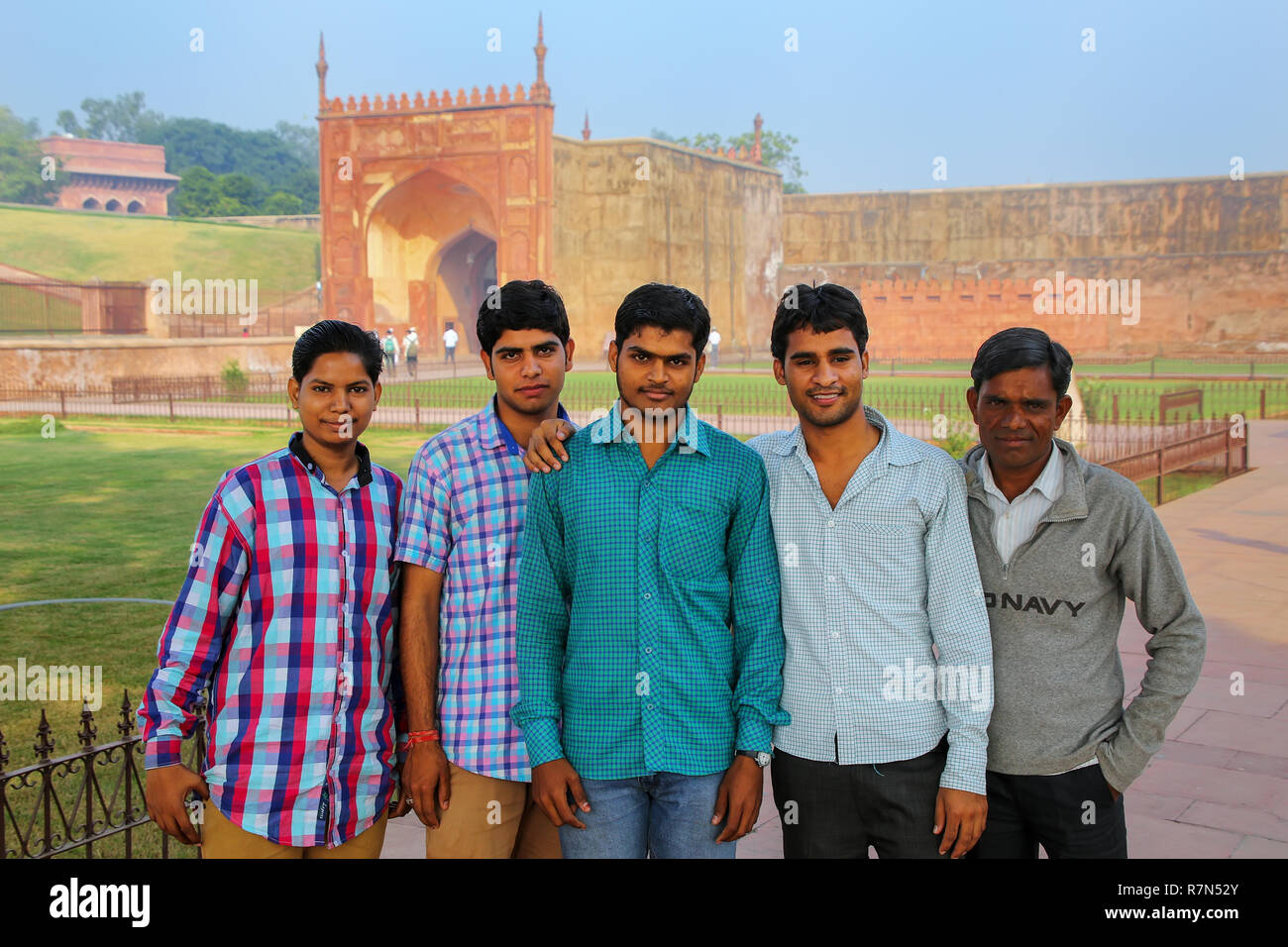 Local men standing in Agra Fort, Uttar Pradesh, India. The fort was built primarily as a military structure, but was later upgraded to a palace. Stock Photo