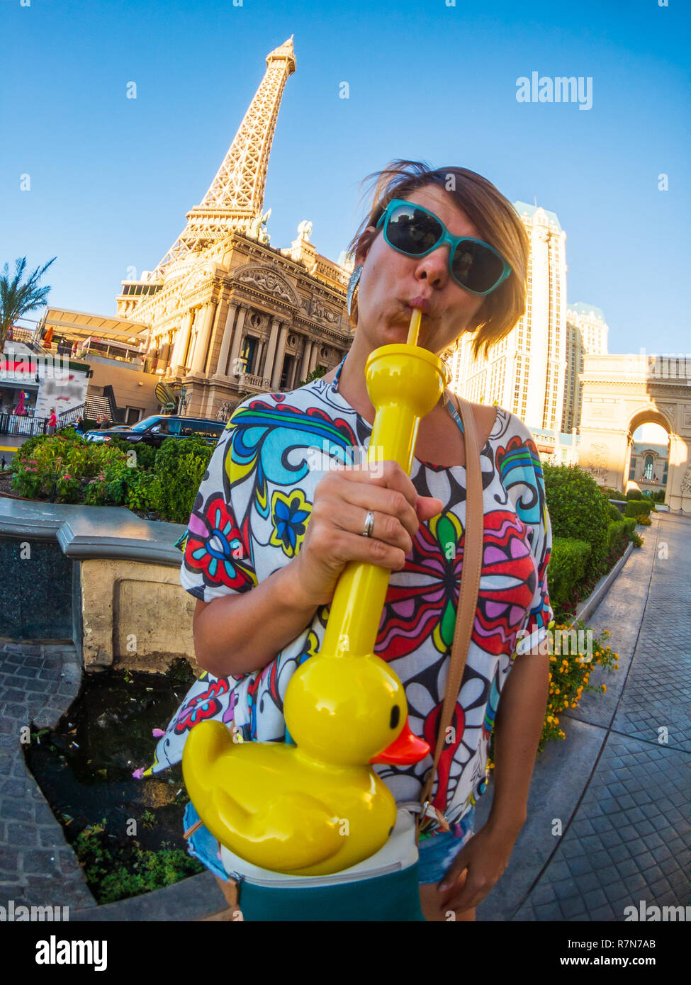 Young woman drinks funny duck shake in Las Vegas Stock Photo - Alamy