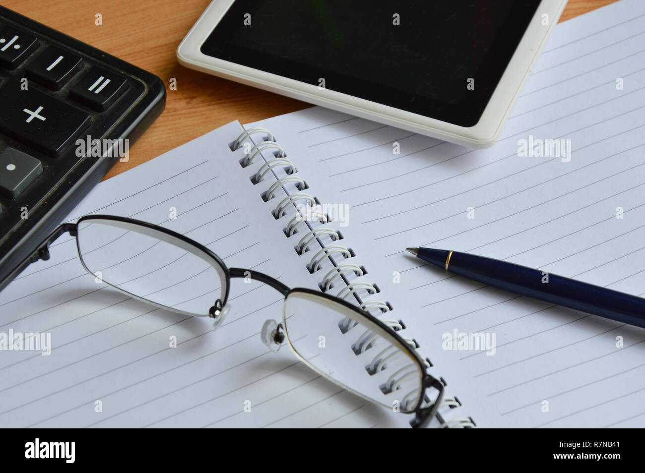 eyeglass and business stationery on working desk Stock Photo Alamy