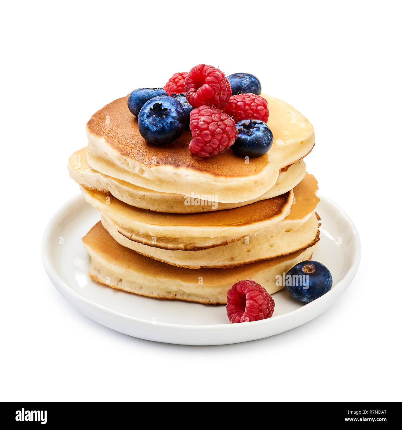 Tasty homemade pancakes with berries on white background Stock Photo