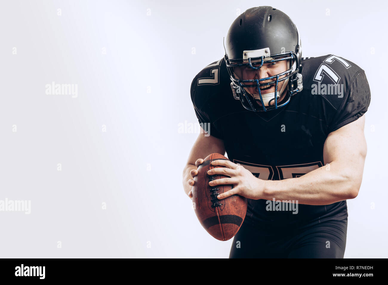 Quarterback throwing a football in a professional football game Stock Photo Alamy