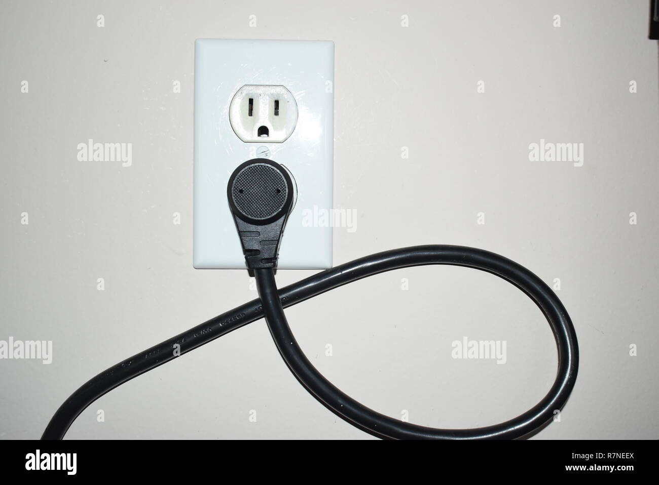 Extension cord plugged in outlet hi-res stock photography and images - Alamy
