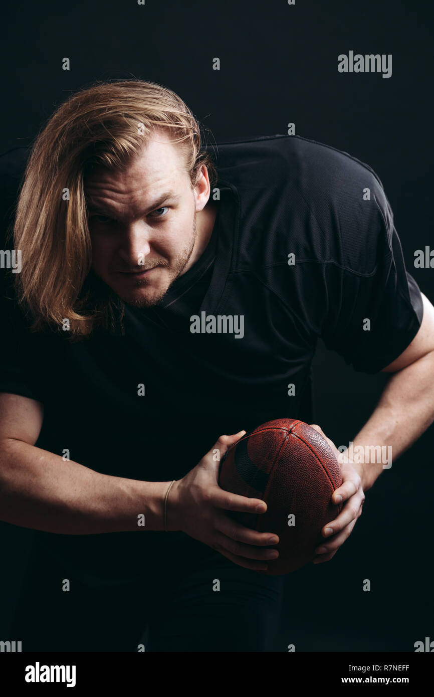 Quarterback throwing football touchdown hires stock photography and