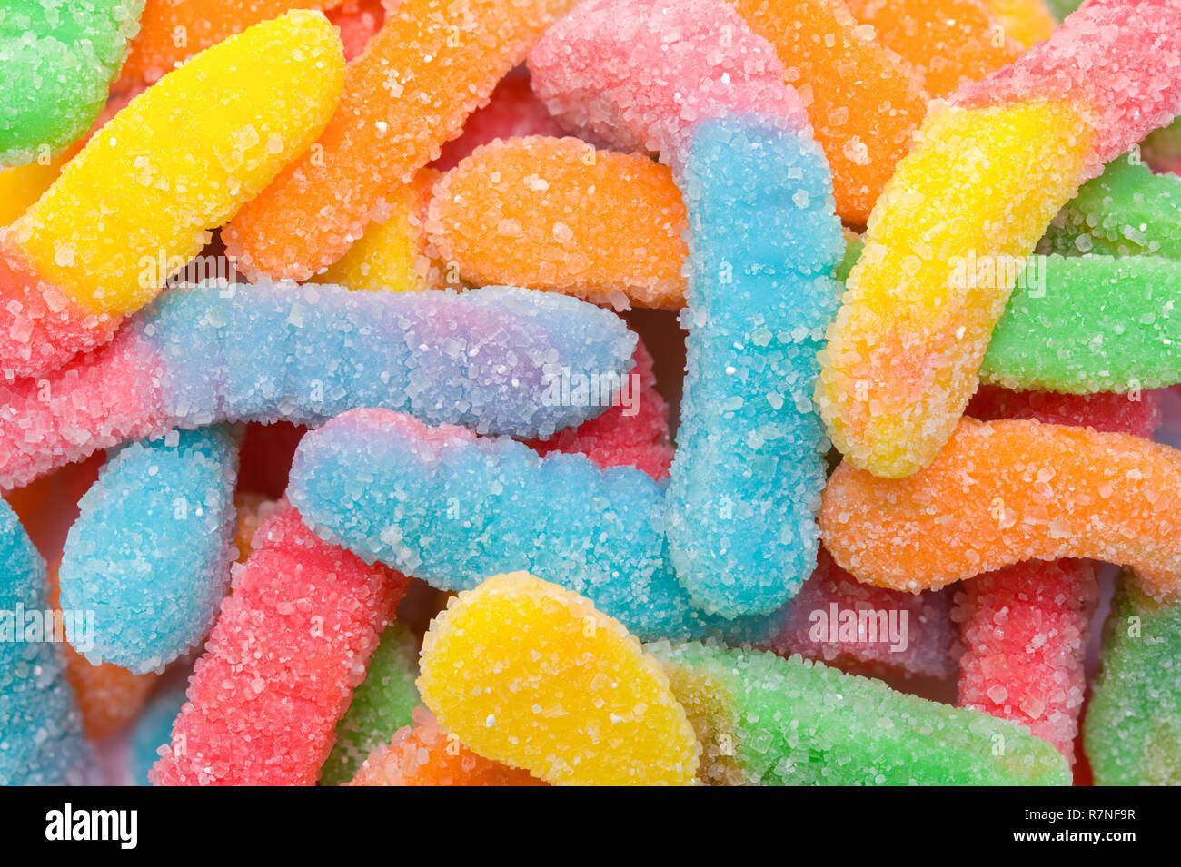 Pile of Candy Gummy Worms Background Close Up. Stock Photo