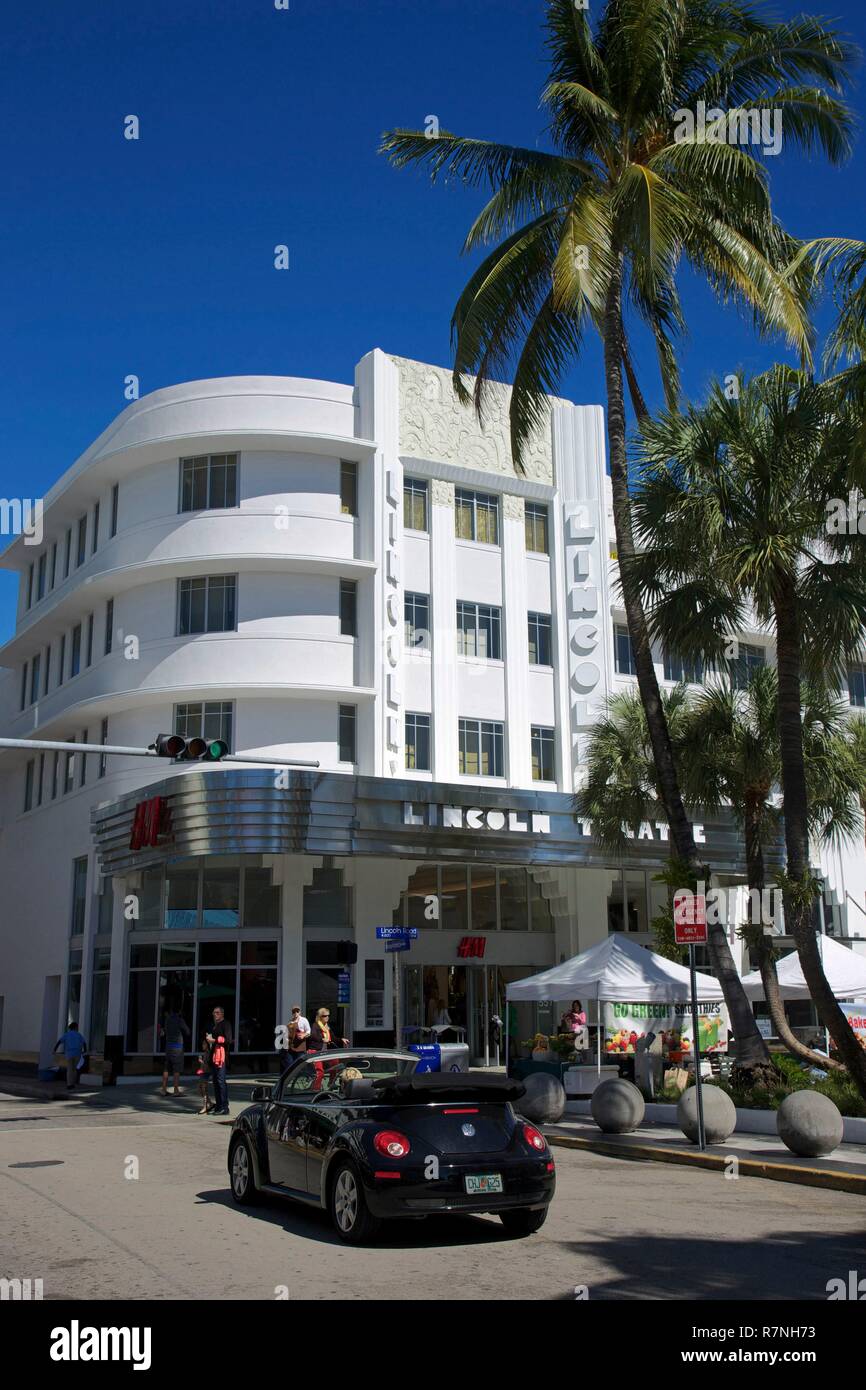 United States, Florida, Miami, New Beetle passing in front of the facade Art Deco of the old Lincoln theatre, on Lincoln road, on the South Beach district Stock Photo